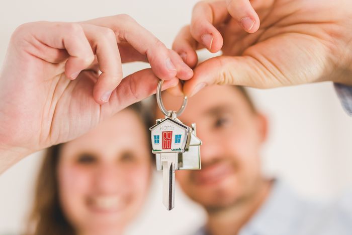 A happy couple holding up new house keys after Karen shows up to stranger's home for her son. A happy couple holding up new house keys after Karen shows up to stranger's home for her son.