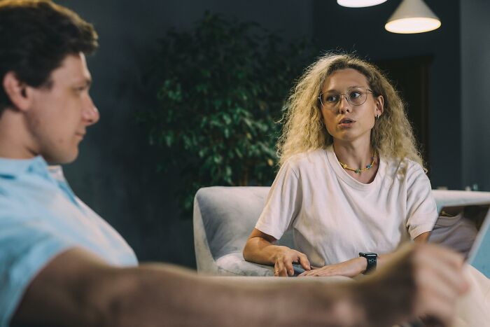 Woman expressing anger during serious talk with man
