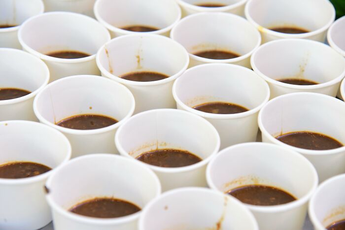 Close up of multiple cups with black coffee for scientific questions