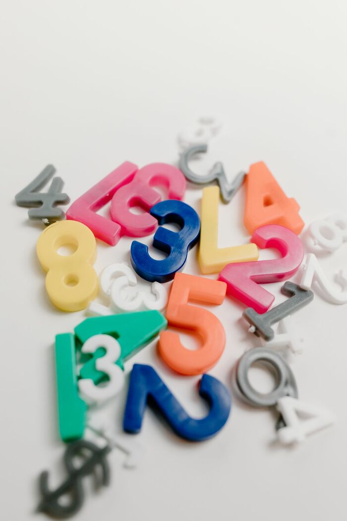 A pile of colorful plastic numbers and letters, symbolizing the 52 crazy facts that are somehow true.