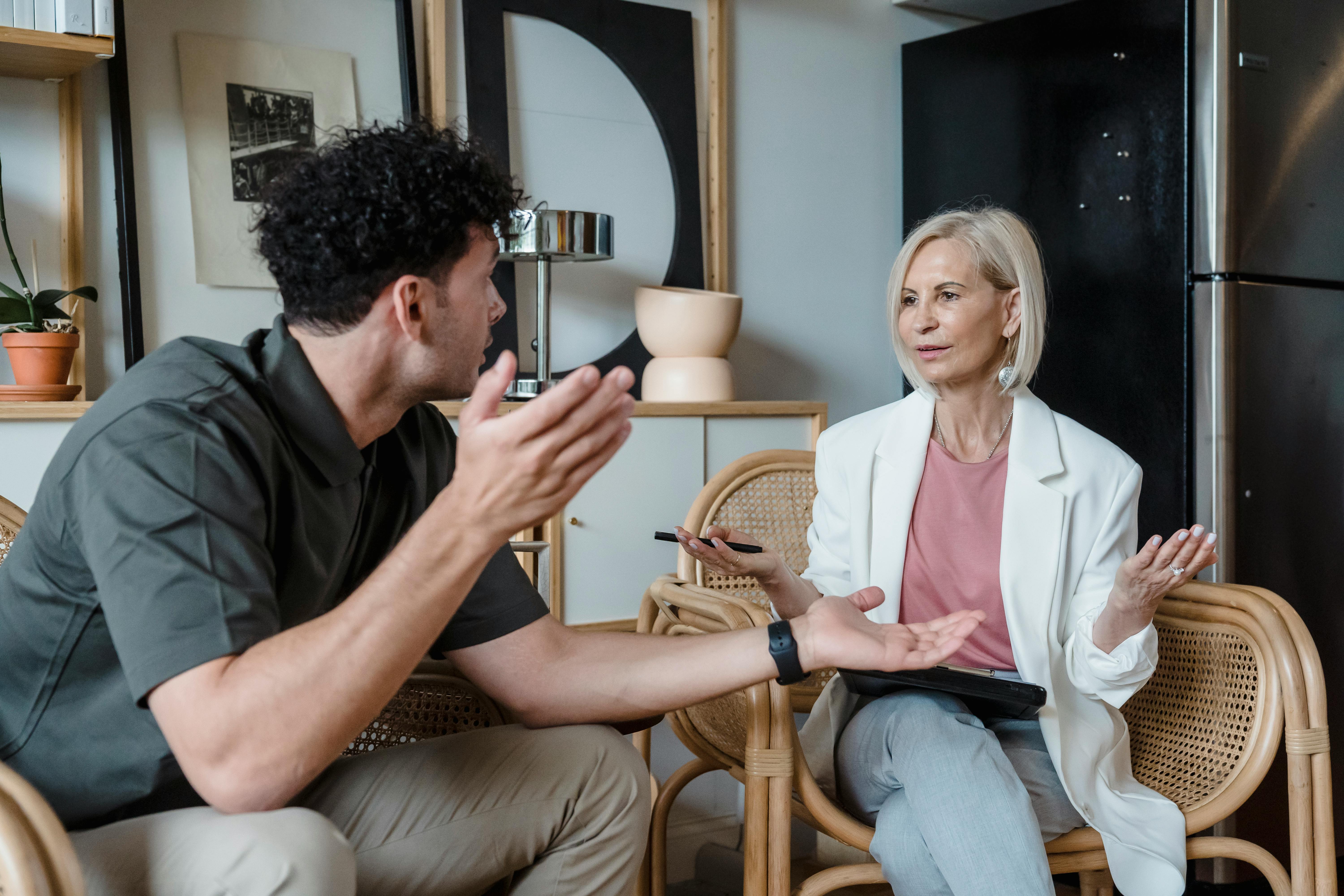 Man and woman arguing about boundaries in babysitting with mother-in-law