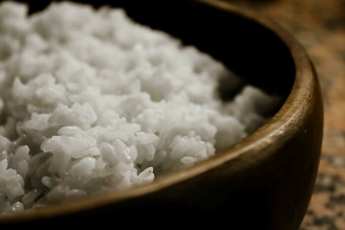 Close-up of cooked white rice in wooden bowl food facts