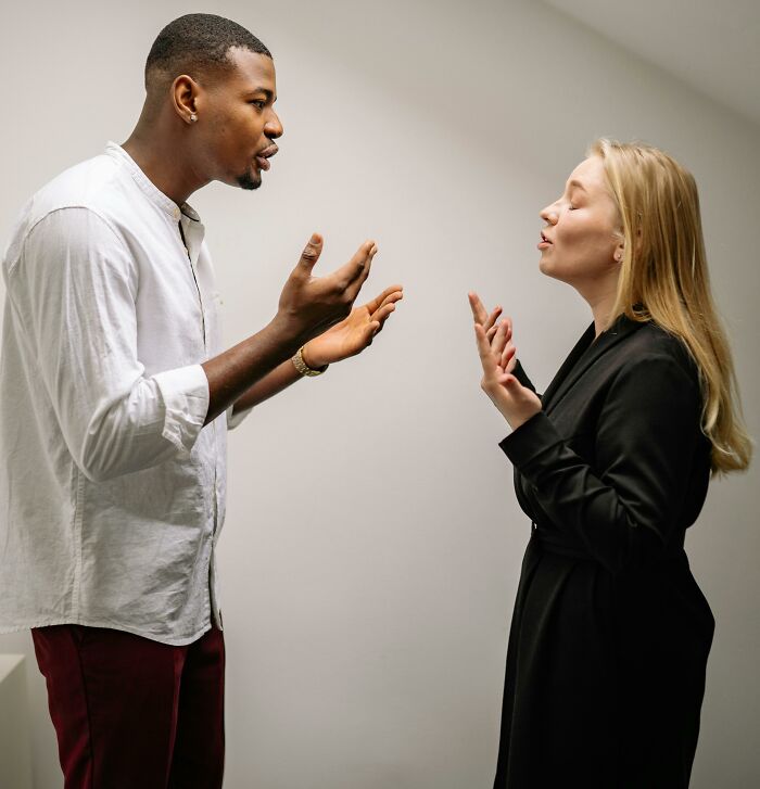 Man and woman in heated verbal argument showing savage women verbal weapons