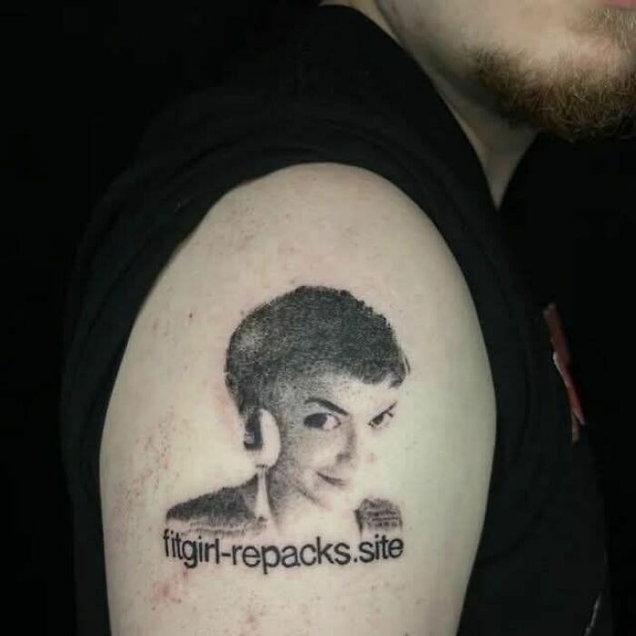 A man's arm with a tattoo of a woman's face and text, making a fever dream meme.