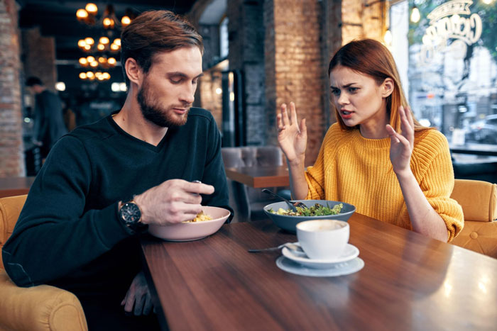 A man and his picky eater girlfriend having a disagreement in a restaurant, affecting their relationship. A man and his picky eater girlfriend having a disagreement in a restaurant, affecting their relationship.