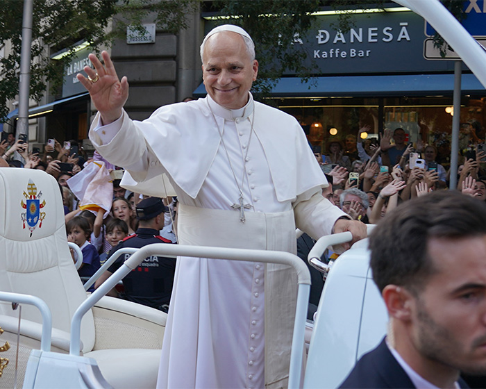 Pope waving and greeting crowd from popemobile during public appearance Pope waving and greeting crowd from popemobile during public appearance