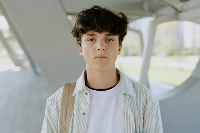 Serious young person looking at camera representing psychopath traits identification