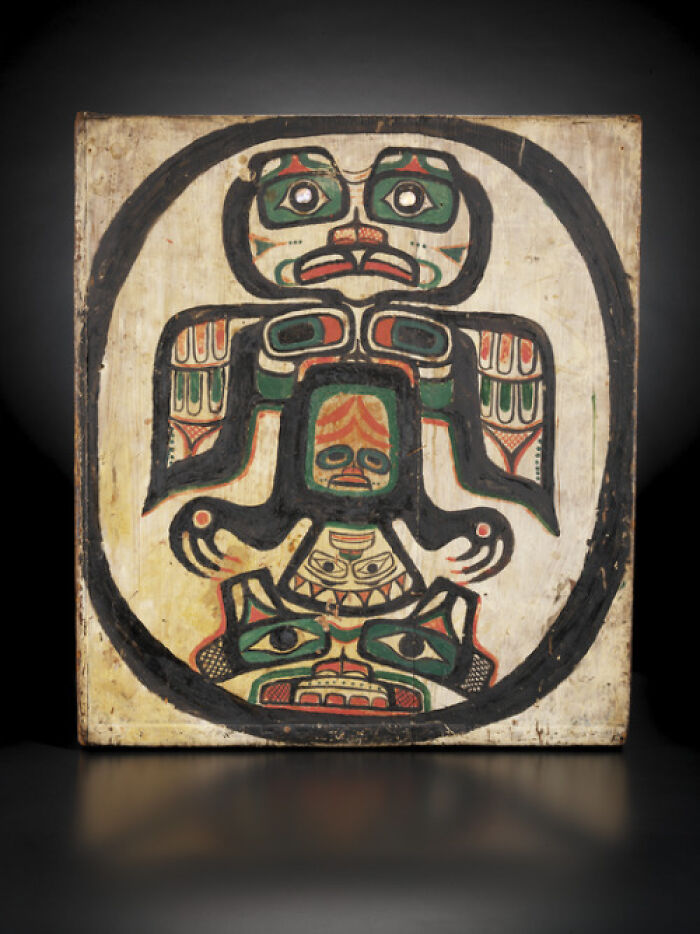 An indigenous painting depicting a stylized figure in a black oval, an intact historical object.