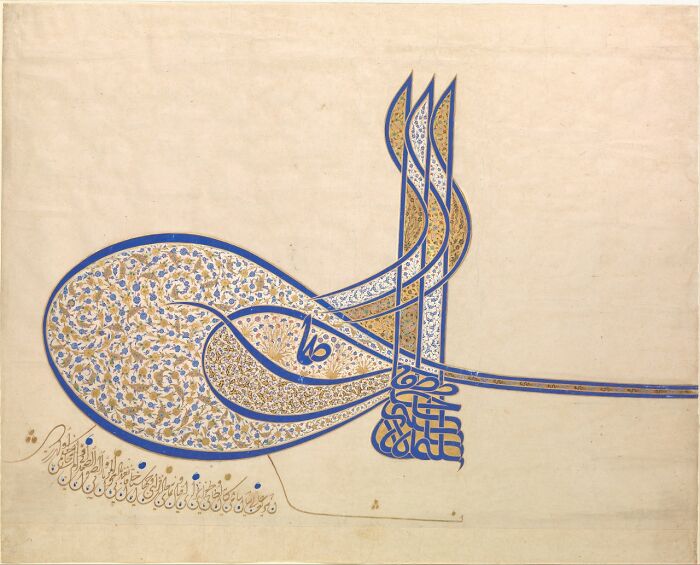 An intricately designed calligraphic object with blue and gold patterns, an interesting object still intact.