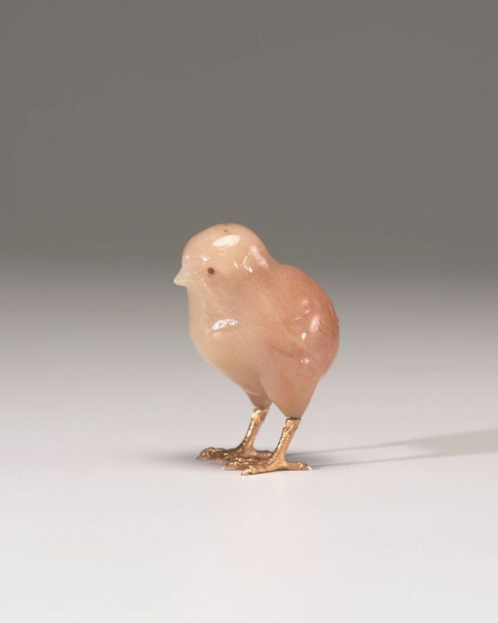 A tiny, carved chick with gold feet, one of the interesting objects that are still intact after all these years.