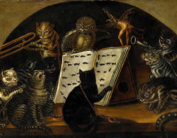 Intact after years, a whimsical painting of cats and an owl playing musical instruments, with a sheet of music showing mice.