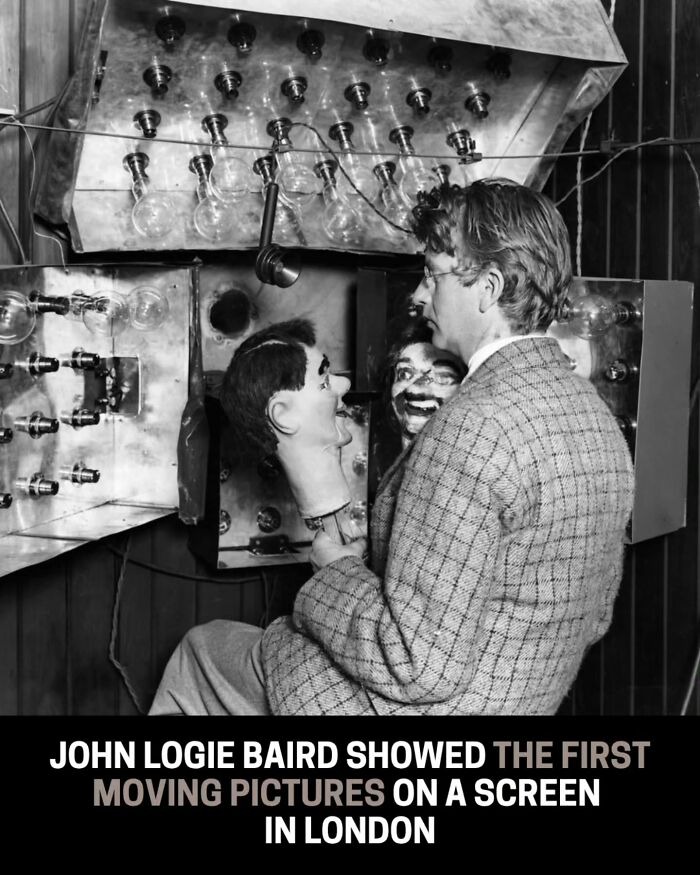 Historical photo of John Logie Baird with his apparatus for showing the first moving pictures on a screen in London.