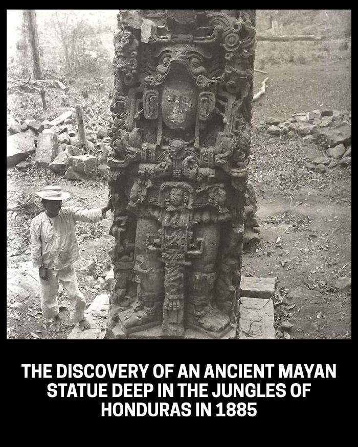 A man next to an ancient Mayan statue discovered in the jungles of Honduras in 1885, a rare and interesting historical photo.