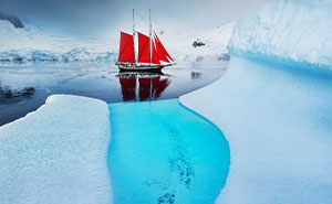 This Photographer Captured Antarctica’s Frozen Landscapes From A Red-Sailed Schooner (42 Pics)