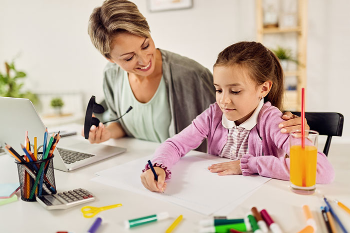 Auntie helping daughter with homework showing care amid health issues concerns Auntie helping daughter with homework showing care amid health issues concerns