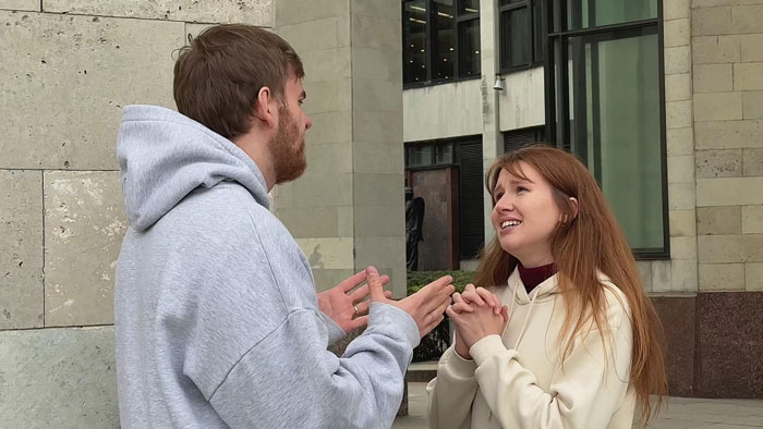 Couple arguing outside building before wedding breakup Couple arguing outside building before wedding breakup