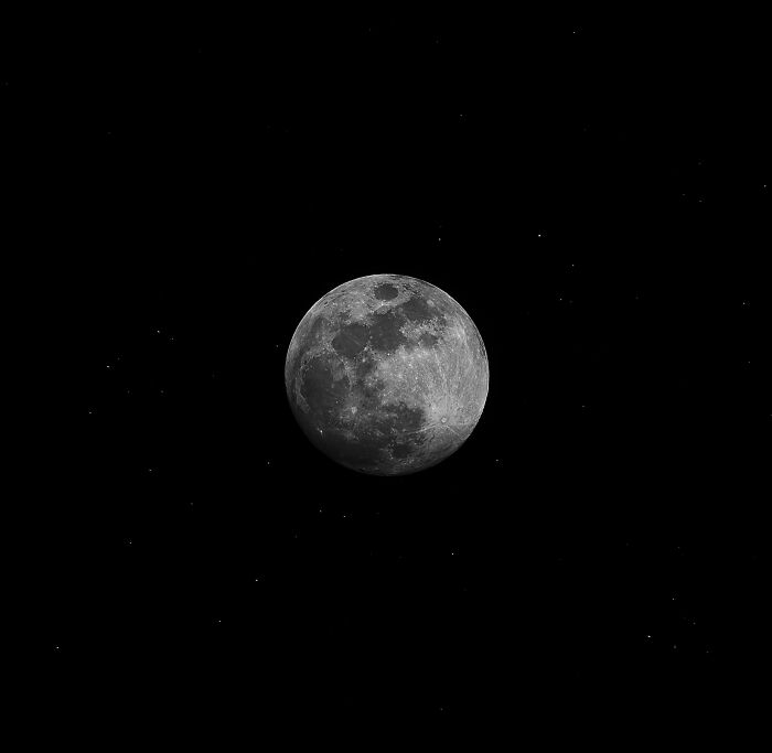 Close-up of full moon with visible craters in night sky