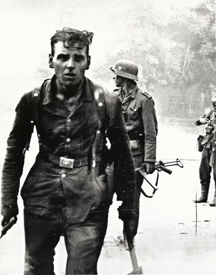 A grim historical photo depicts a disheveled soldier walking, another of the impossible to explain moments captured in historical photos.