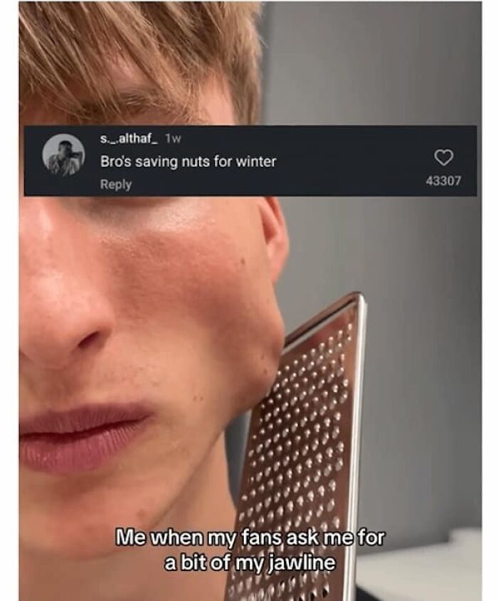 A man with a prominent jawline holds a cheese grater to his face, a humorous visual for hilariously savage burns.
