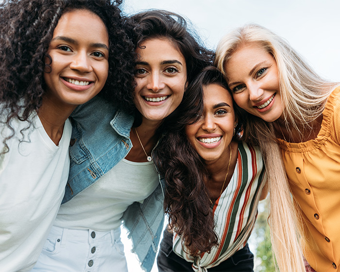 Group of diverse women smiling showing female attractiveness Group of diverse women smiling showing female attractiveness