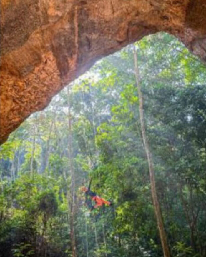 Person rappelling inside cave during Brazil hiking accident Person rappelling inside cave during Brazil hiking accident