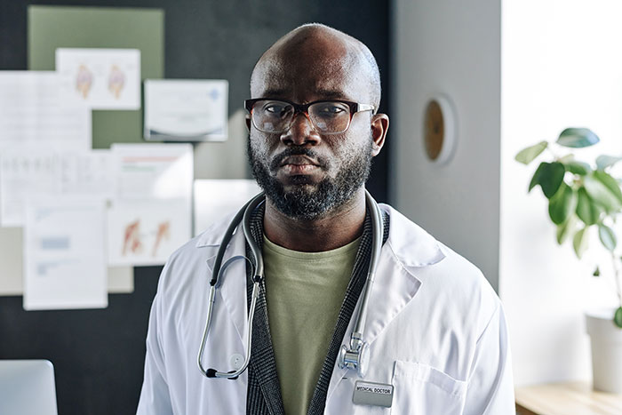 A doctor with a serious expression, highlighting the confidential nature of secrets people keep.