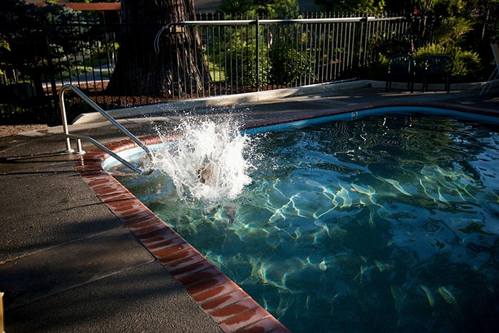 Water splashing in a pool, metaphor for the impact of secrets that ruin lives.