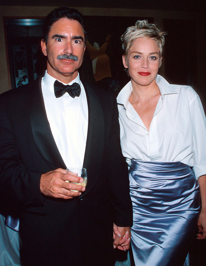 Sharon Stone and her husband holding hands at a black-tie event