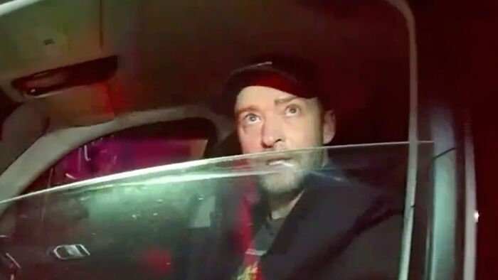 Justin Timberlake looking surprised in a car, an image related to recent celebrity scandals.