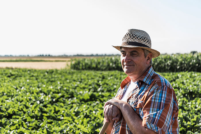 Farmer in field with hat symbolizing smooth criminals potential