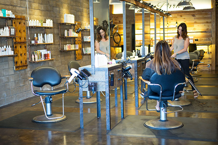 Women getting hair styled in salon showing smooth criminals