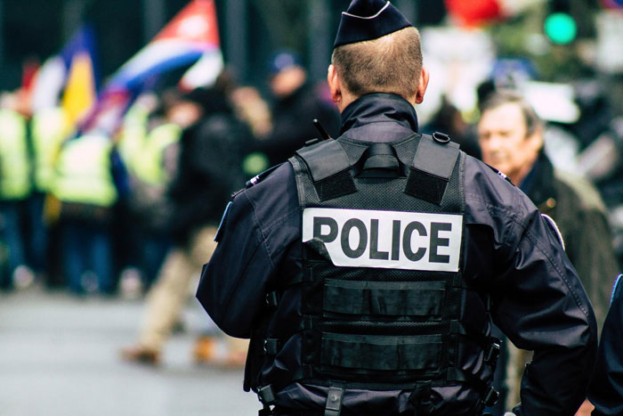 Police officer in uniform at a crowded event Police officer in uniform at a crowded event