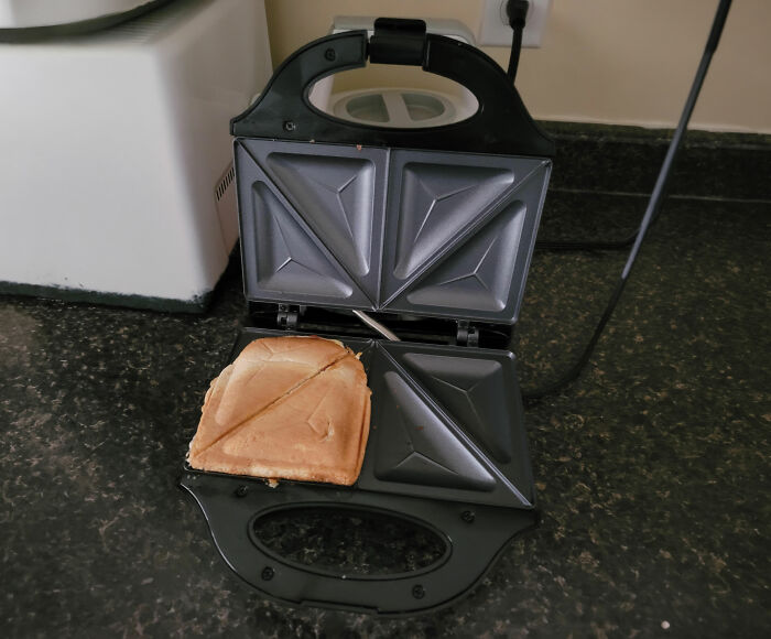 Sandwich in a toaster showing creepy hospital food scenario