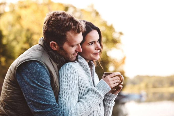 A couple embraces, representing the complex family dynamics of house rules and stepdaughter relationships. A couple embraces, representing the complex family dynamics of house rules and stepdaughter relationships.