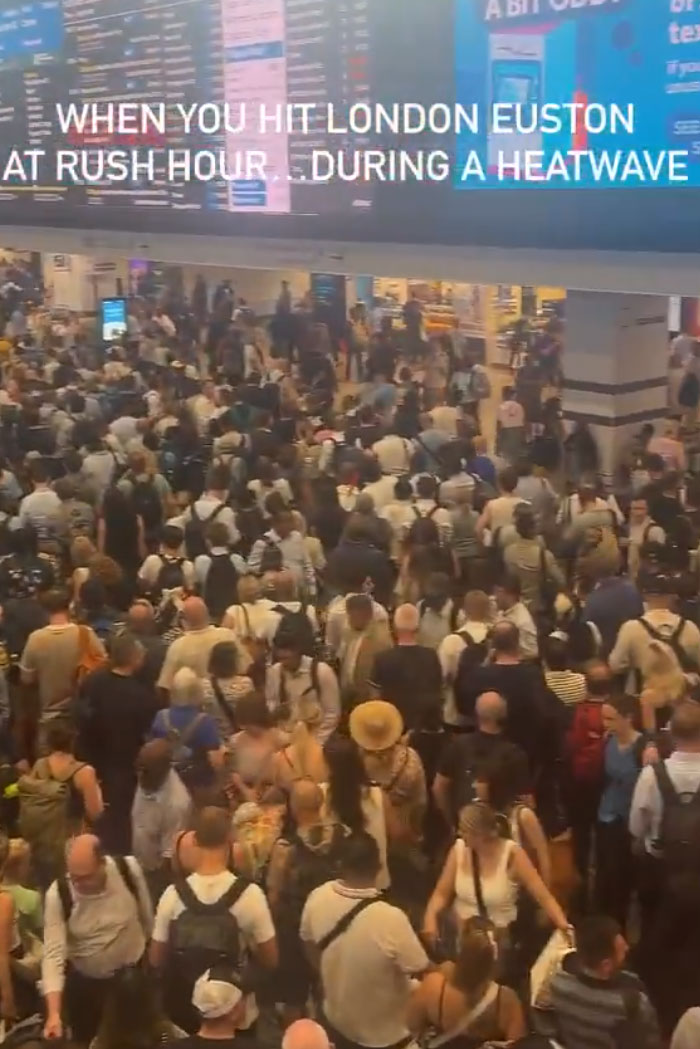 A crowded train station filled with Europeans during a heatwave, trying to survive the heatwave.