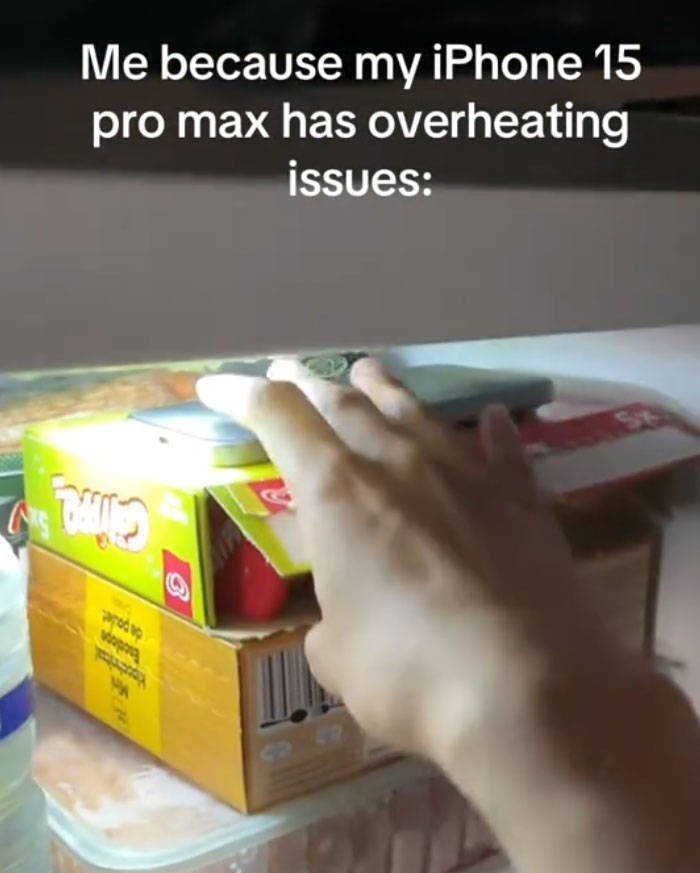 A European uses ice packs to cool down an overheating iPhone 15 Pro Max during the heatwave.