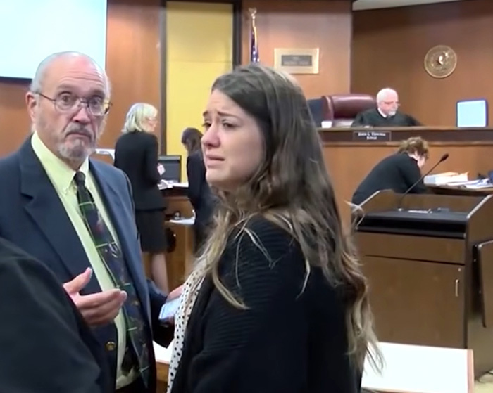 A crying Taylor Parker in a courtroom, with a lawyer looking towards the camera, highlights gruesome details.