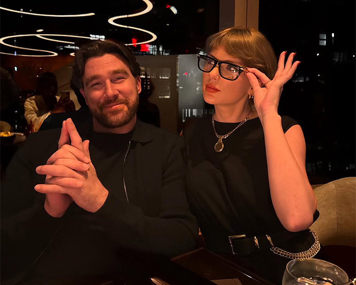 Taylor Swift wearing glasses and a man smiling in a dimly lit restaurant, sparking wedding backlash.