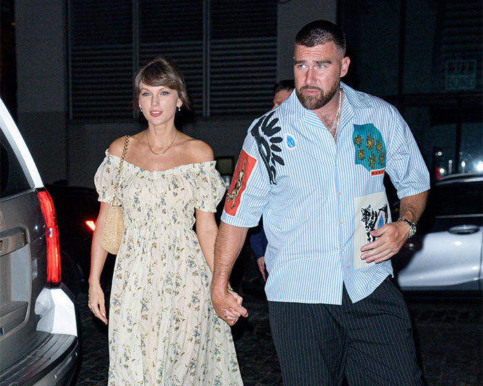 Taylor Swift and partner holding hands, sparking wedding backlash due to reported elitist plans.