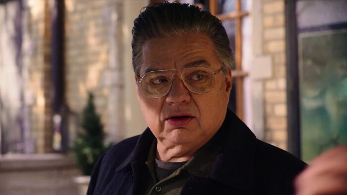The Bear's Berzatto family members and relationships: A man with glasses, a member of the Berzatto family, looking surprised.