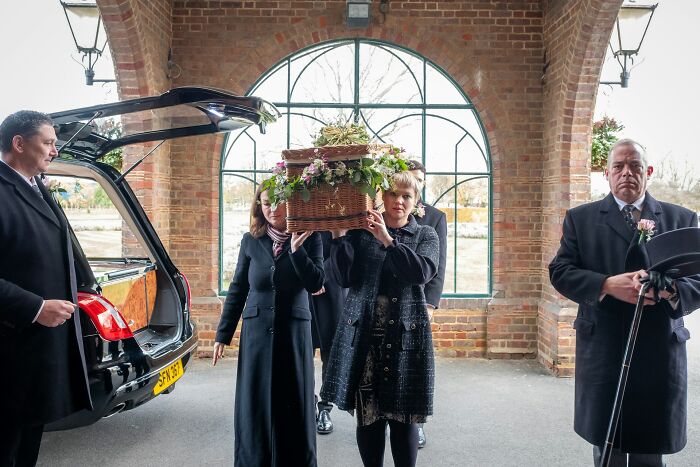 People carrying a wicker coffin from a hearse at a funeral. A look into some unusual jobs related to services.