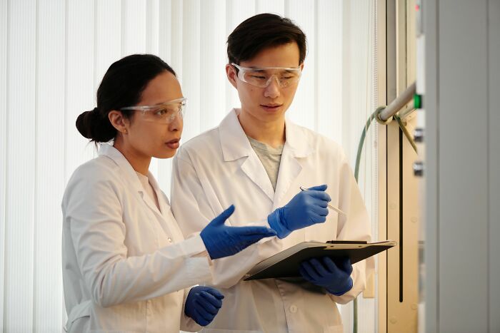 Scientists discussing research results on AI-caused great depression predictions