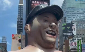 Giant Inflatable Of Elon Musk Mysteriously Appears In Times Square With Scathing Message