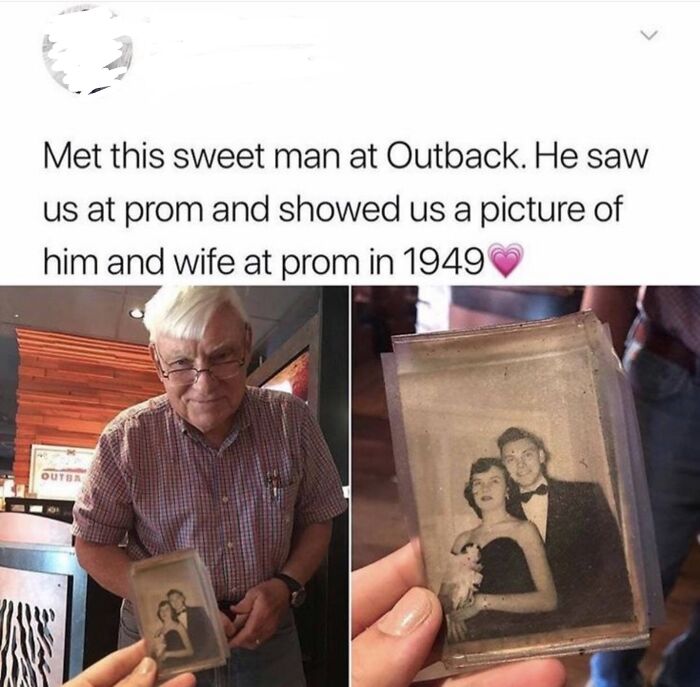 Older man showing a prom photo from 1949 at Outback Steakhouse