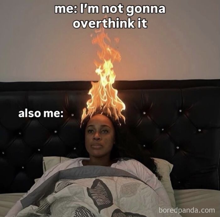 Humorous meme of a person with fire on head about overthinking