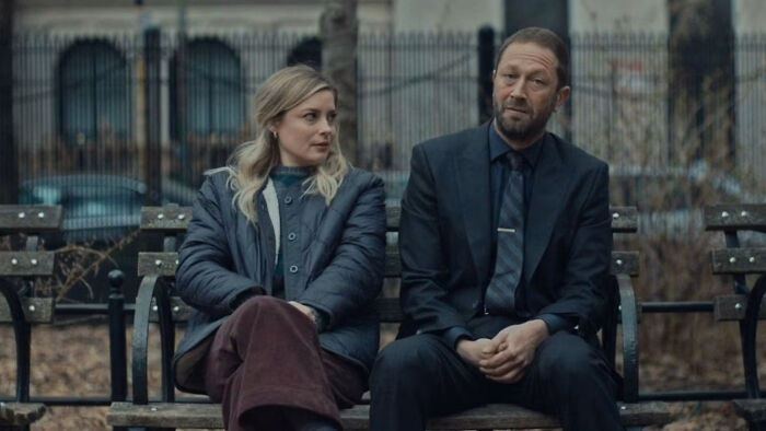 The Bear Season 5 guest star Abby Elliott and Bob Odenkirk sit on a park bench.
