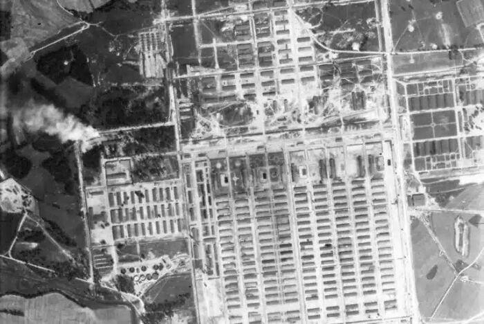 Historical photos: An aerial black and white shot of a large, sprawling complex with many buildings and structures.