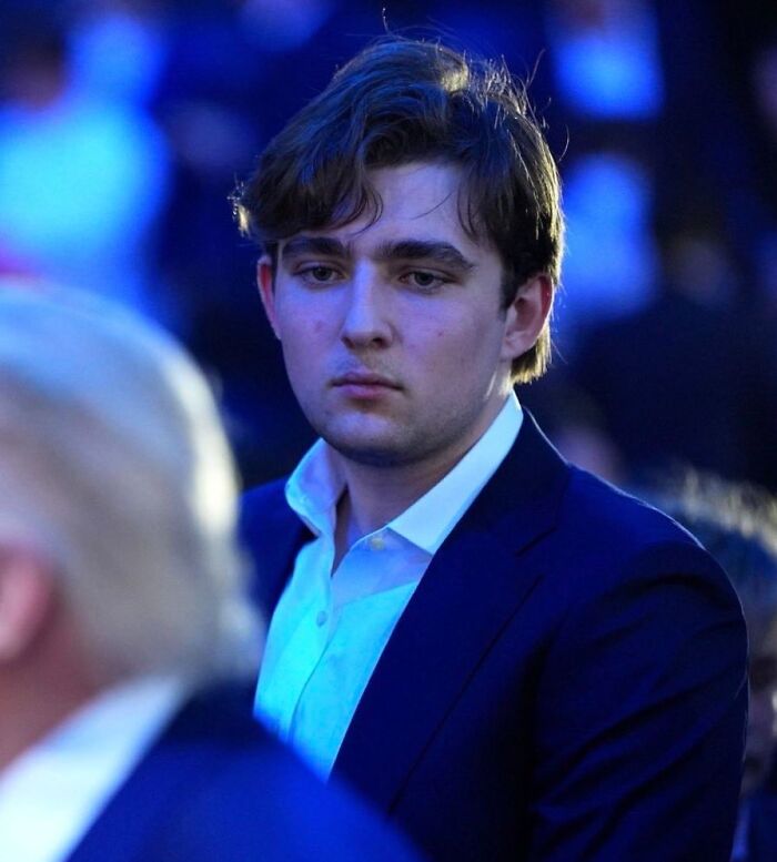 Young man in suit attending UFC 250 fight held on the White House lawn
