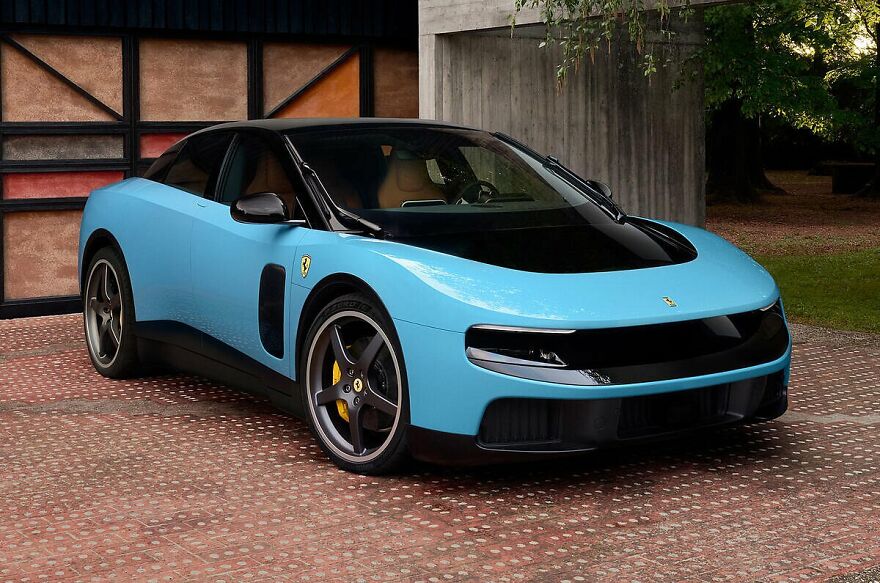 A light blue Ferrari, an ugly car that became legendary, parked in front of a modern building.
