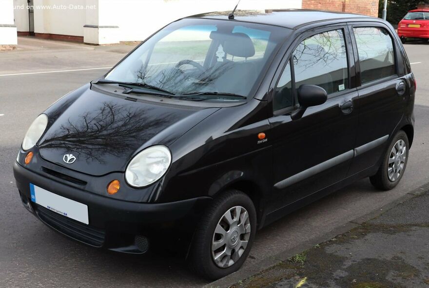 A black Daewoo Matiz, a legendary ugly car, parked on a street.